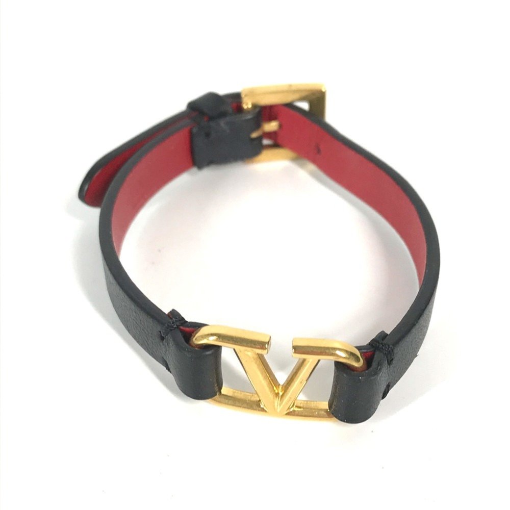 Valentino black leather bracelet with gold logo “V”